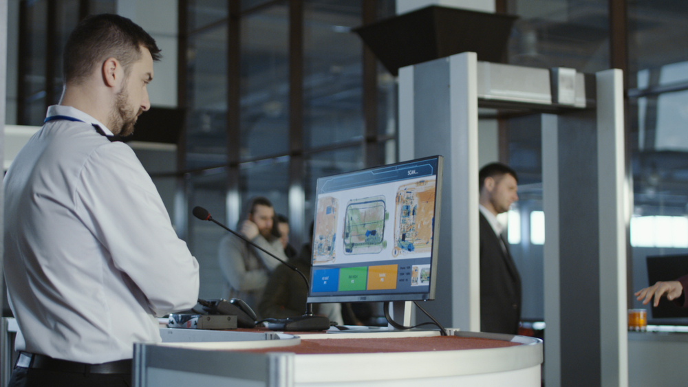 A man running customers when checking what travel items you can bring when immigrating to the U.S.